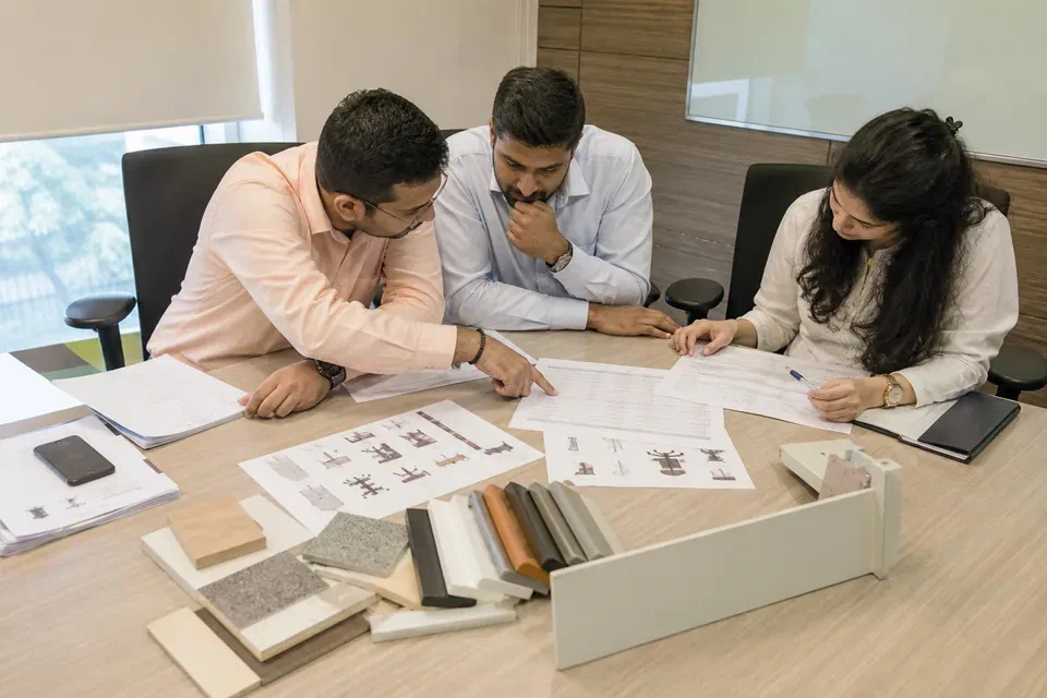 Illustrative WoodAge procurement review of an office furniture BOQ drawing and material samples in Gurugram