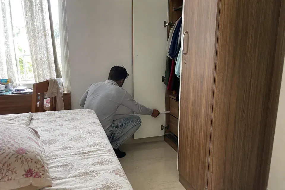 Illustrative Gurugram bedroom plan comparing hinged wardrobe swing with sliding wardrobe standing clearance